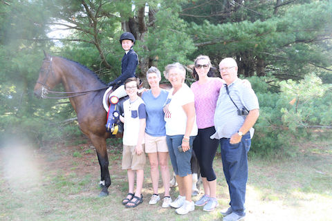 Family group photo after daughter wins her class